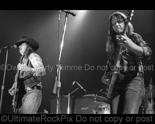 Photo of Toy and Tommy Caldwell of The Marshall Tucker Band in concert in 1974 by Marty Temme