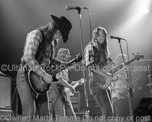 Photo of brothers Toy and Tommy Caldwell of The Marshall Tucker Band in concert in 1974 by Marty Temme