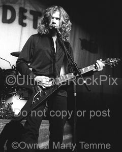 Black and white photo of Dave Mustaine of Megadeth in concert by Marty Temme