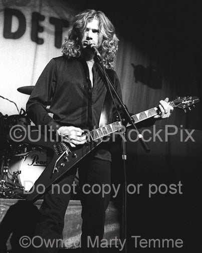 Black and white photo of Dave Mustaine of Megadeth in concert by Marty Temme