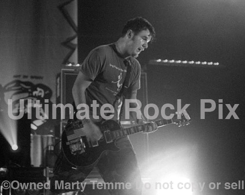 Photo of Chad Gilbert of New Found Glory in concert in 2002 by Marty Temme