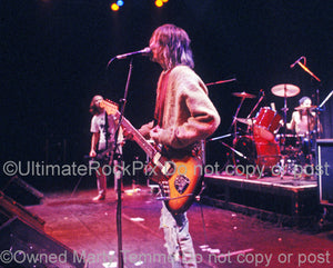 Photo of Kurt Cobain of Nirvana playing his Fender Jaguar in 1991 by Marty Temme