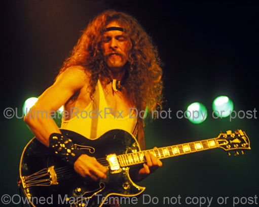 Photo of guitarist Ted Nugent in concert in 1977 by Marty Temme
