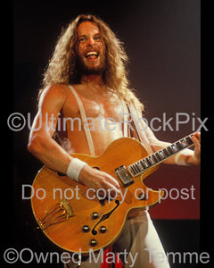Photo of guitar player Ted Nugent in concert in 1980 by Marty Temme