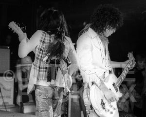Photo of Sylvain Sylvain and Johnny Thunders of New York Dolls in concert in 1974 by Marty Temme