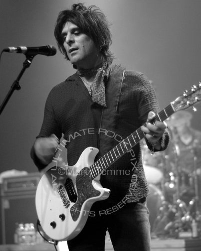 Black and white photo of Steve Conte of New York Dolls in concert by Marty Temme