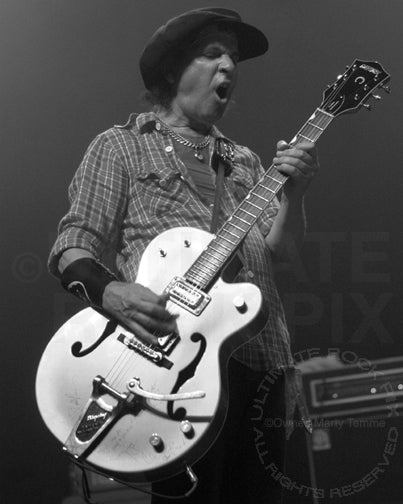 Black and white photo of Sylvain Sylvain of New York Dolls in concert in 2008 by Marty Temme