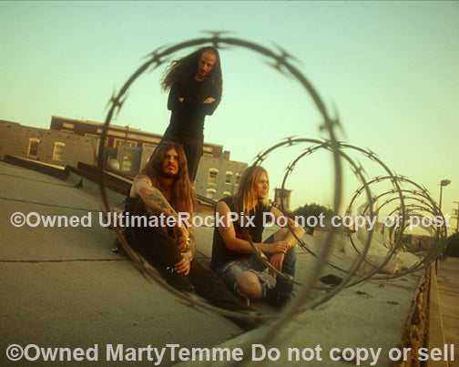 Photo of Scott Weinrich, Guy Pinhas and Greg Rogers of The Obsessed on a rooftop by Marty Temme