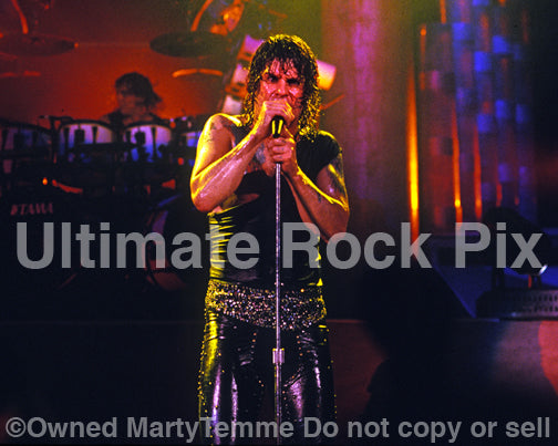 Photo of singer Ozzy Osbourne performing in concert in 1989 by Marty Temme