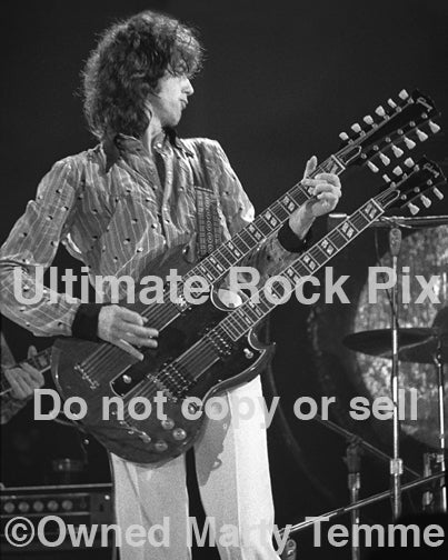 Photo of Jimmy Page of Led Zeppelin playing a Doubleneck SG in concert in 1973 by Marty Temme