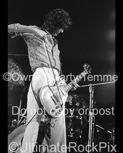 Photos of Guitar Player Jimmy Page of Led Zeppelin Playing a Gibson Les Paul with a Violin Bow in Concert in 1973 by Marty Temme
