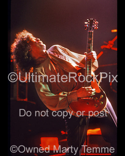 Photo of Jimmy Page playing his Les Paul Goldtop in concert - page882
