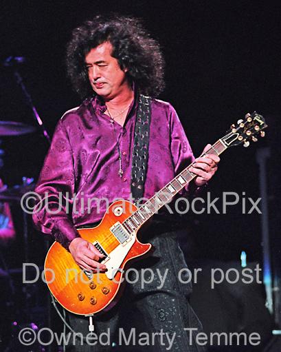 Photos of Guitarist Jimmy Page of Page and Plant Playing a Gibson Les Paul in Concert in 1995 by Marty Temme