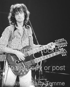 Photo of Jimmy Page of Led Zeppelin playing a Gibson doubleneck in Concert in 1973 by Marty Temme