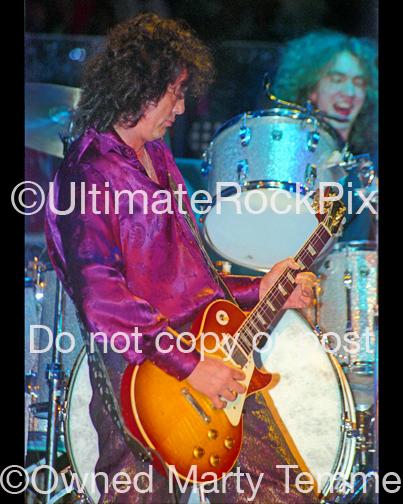 Photos of Jimmy Page of Page and Plant Playing a Gibson Les Paul in Concert in 1995 by Marty Temme