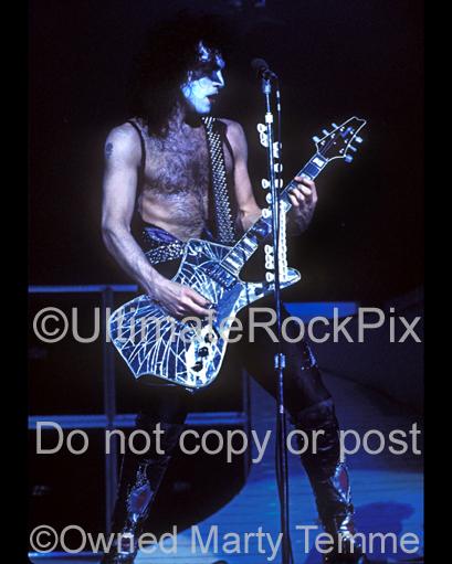 Photo of Paul Stanley of Kiss in concert in the 1970's by Marty Temme