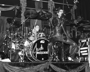 Photo of Perry Farrell and Stephen Perkins of Janes Addiction in concert by Marty Temme