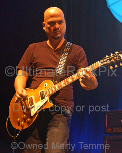 Photo of guitarist Joey Santiago of The Pixies in concert by Marty Temme