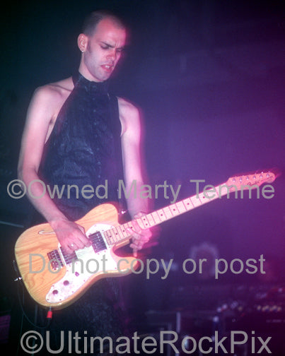 Photo of musician Stefan Olsdal of the band Placebo in concert by Marty Temme