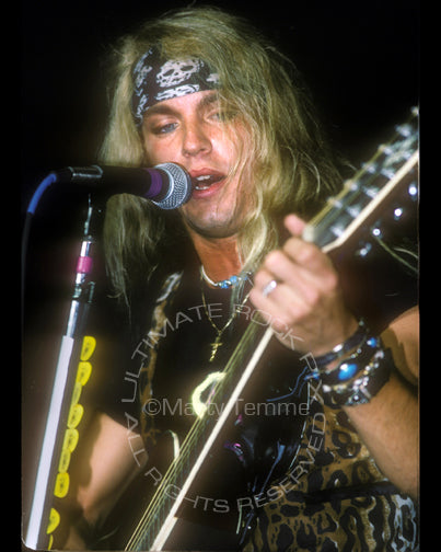 Photo of Bret Michaels of Poison in concert in 1990 by Marty Temme