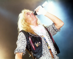 Photo of Bret Michaels of Poison in concert in 1989 by Marty Temme