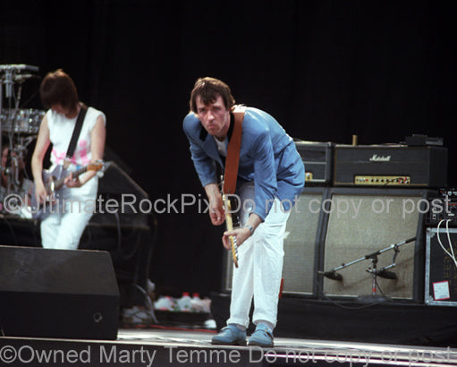 Photo of Robbie McIntosh of The Pretenders in concert in 1983 by Marty Temme