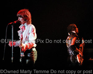 Photo of Chrissie Hynde and Pete Farndon of The Pretenders in concert in 1981 by Marty Temme