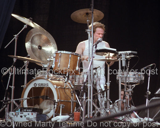 Photo of Martin Chambers of The Pretenders in concert in 1983 by Marty Temme