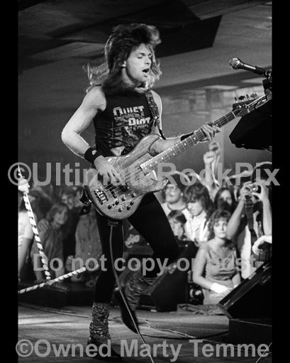 Photo of bass player Rudy Sarzo of Quiet Riot in concert in 1983 by Marty Temme