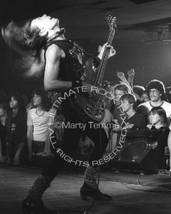 Photo of bassist Rudy Sarzo of Quiet Riot in concert in 1983 by Marty Temme