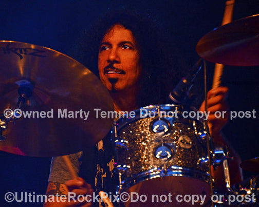 Photo of drummer Frankie Banali of Quiet Riot in concert in 2013 by Marty Temme