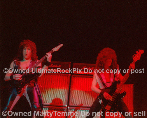 Photo of Michael Wilton and Eddie Jackson of Queensryche in concert in 1985 by Marty Temme
