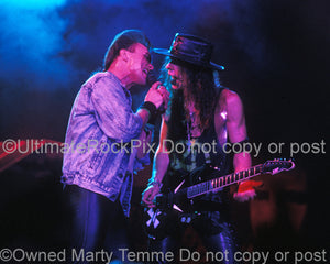 Photo of Geoff Tate and Chris DeGarmo of Queensryche in concert in 1989 by Marty Temme