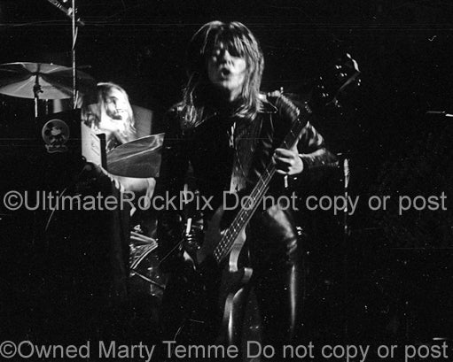 Photo of Suzi Quatro in concert in 1973 by Marty Temme