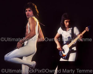 Photos of Freddie Mercury and John Deacon of Queen in Concert in 1977 by Marty Temme