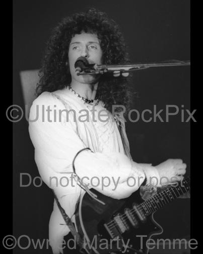 Photos of Guitarist Brian May of Queen Performing in Concert in 1977 by Marty Temme
