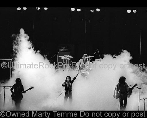 Photos of Freddie Mercury, Brian May, Roger Taylorand John Deacon of Queen Performing in Concert in 1975 by Marty Temme