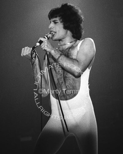 Black and white photo of Freddie Mercury of Queen onstage in 1977 by Marty Temme