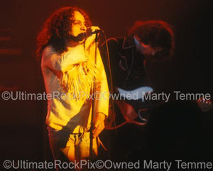Photo of Ronnie James Dio and Ritchie Blackmore of Rainbow in concert in 1978 by Marty Temme