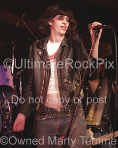 Photo of singer Joey Ramone of The Ramones in concert in 1978 by Marty Temme