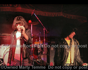 Photo of Joey and Dee Dee Ramone of The Ramones in concert in 1978 by Marty Temme