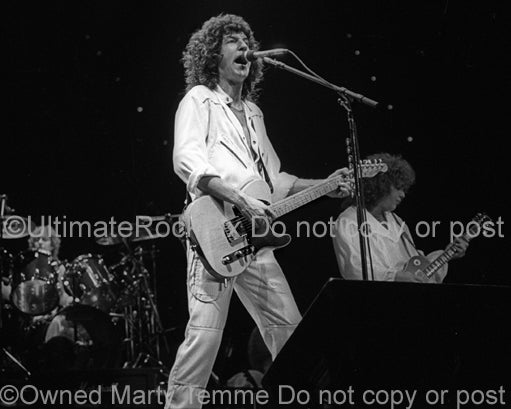 Photo of Kevin Cronin of REO Speedwagon in concert in 1981 by Marty Temme