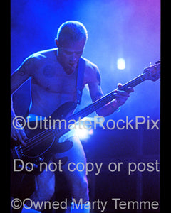 Photo of bassist Flea of The Red Hot Chili Peppers in concert in 1992 by Marty Temme