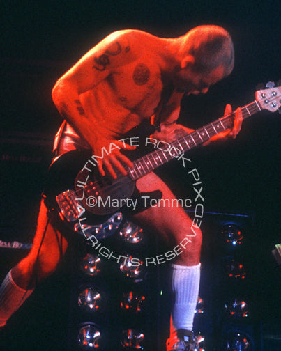 Photo of Flea of The Red Hot Chili Peppers in concert in 1992 by Marty Temme
