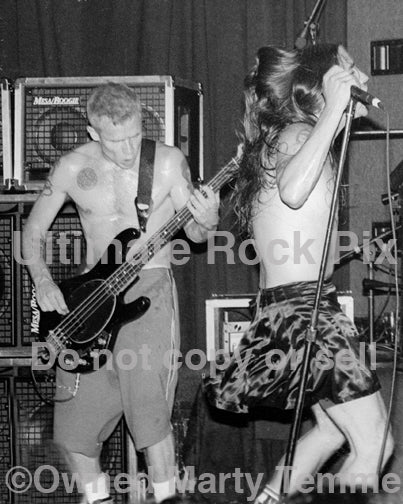 Photo of Flea and Anthony Kiedis of The Red Hot Chili Peppers onstage in 1994 by Marty Temme