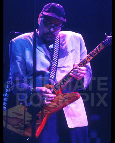 Photo of Rick Nielsen of Cheap Trick in concert in 1997 by Marty Temme