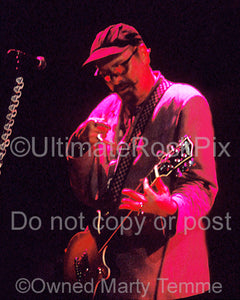 Photo of Rick Nielsen of Cheap Trick playing a Gretsch guitar in concert in 1997 by Marty Temme