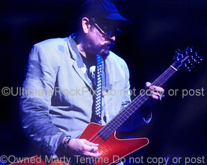 Photo of Rick Nielsen of Cheap Trick playing a Hamer guitar in concert in 1997 by Marty Temme