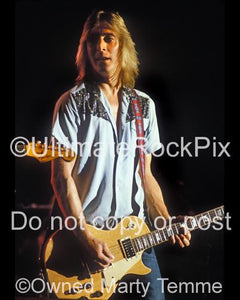 Photos of Guitarist Mick Ronson of Ian Hunter and David Bowie in 1980 by Marty Temme