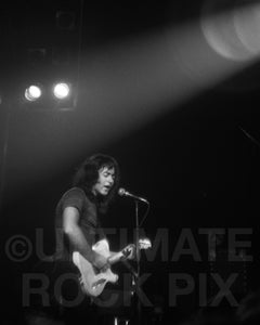 Black and white photo of Rory Gallagher playing his Telecaster in concert in 1973 by Marty Temme